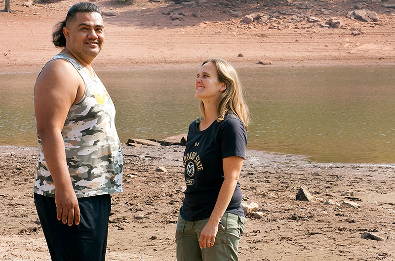 Jessi looks and laughs at Edgar on the beach of a local lake about a year after his stroke.