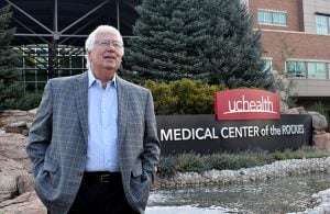 Dr. Gary Luckasen stands in front of UCHealth Medical Center of the Rockies in Loveland, Colorado.