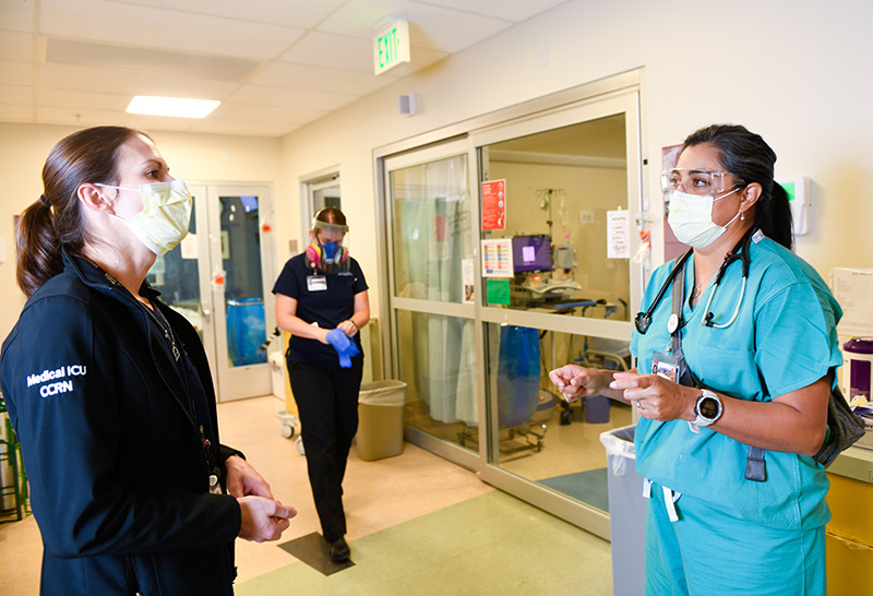COVID-19 ICU nurses working at UCHealth University of Colorado Hospital during the pandemic: left, Olivia Thornton, center, Kate McPhillipsp, and right, Dr. Abbey Lara.