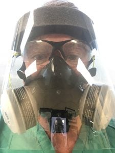 Dr. Richard Zane wearing a respirator mask. A fall COVID-19 spike in Colorado is causing a surge in patients who need hospital care.