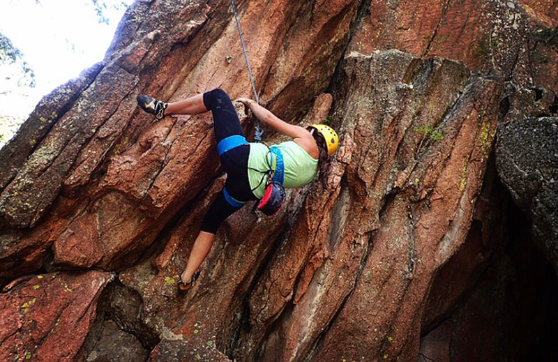 Anna takes on a rock face, this one at Devil’s Head, southwest of Denver. Photo courtesy of Anna Bajaj.