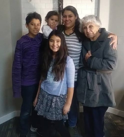 Melissa, with her children and grandmother at church.