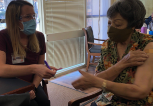 Janice Betha receives vaccine to prevent COVID-19.