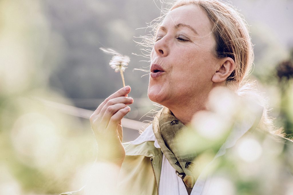 A woman in perimenopause enjoys time outside in this photo.