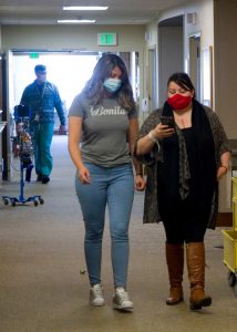 Hernandez and daughter Esmeralda demonstrate the hospitals wayfinding app feature in the halls of UCH.