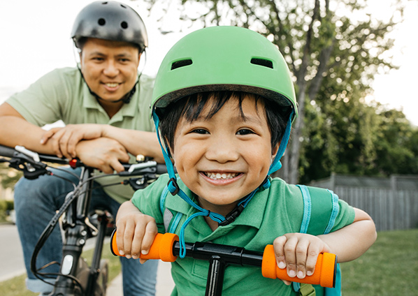Denver parks. Aurora reservoir has a great bike trail around it. Spring is a great time for cycling. Here a father and his young son ride bikes. Photo: Getty Images.