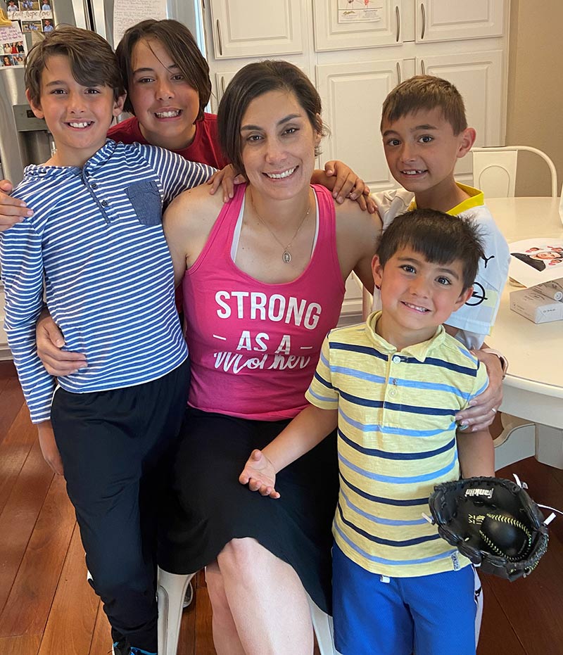 Cathy Pane overcame small bowel cancer. She poses with her four sons. Photo courtesy of Cathy Pane.