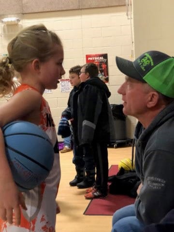 Craig Overman, who uses deep-brain stimulation for his Parkinson's disease, talks with his granddaughter. Photo courtesy of Overmans.