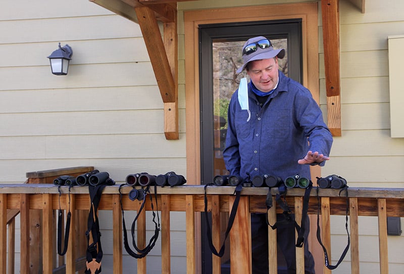 Paul explains binoculars during a mindful bird-watching program recently in the Poudre Canyon. Photo by Kati Blocker, UCHealth.