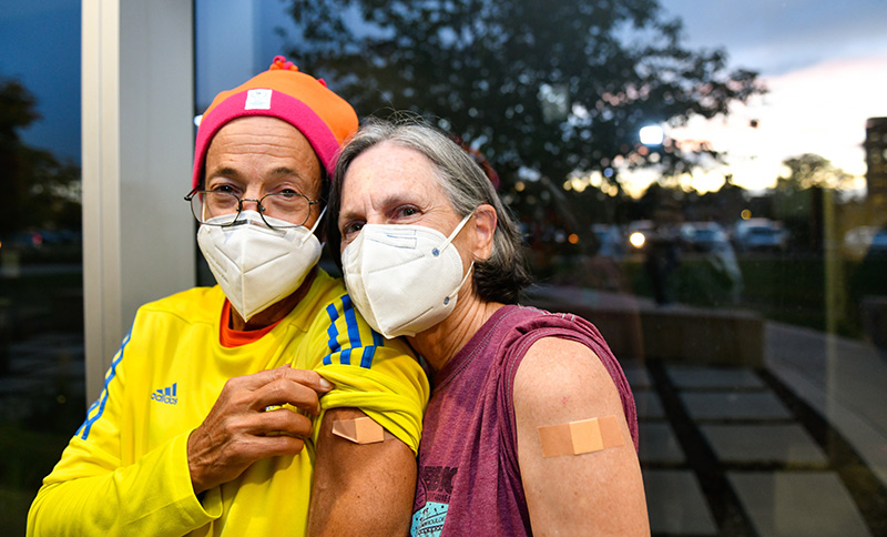 Mike and Nannette Wien pose after getting their COVID-19 booster shots at UCHealth University of Colorado Hospital