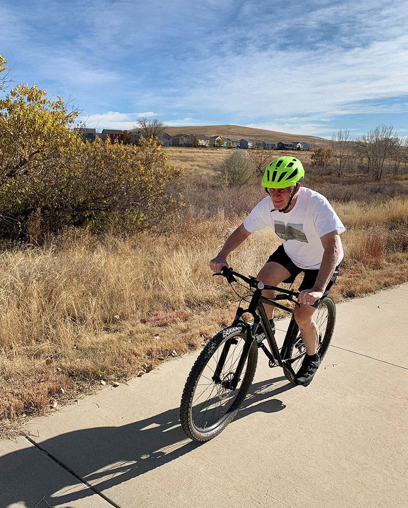 With many precautions, Nelson is back on his bike after inpatient rehab helped with his spinal cord injury recovery.