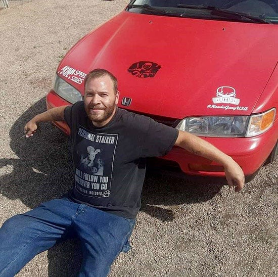 Keith Thiel was in a horrible car wreck where as a trauma patient, he needed whole blood to survive. Here he is in front of the car that he was fixing before the accident totaled it. Photo courtesy of Keith Thiel .