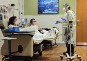 Two patients receive monoclonal antibody treatment at UCHealth Poudre Valley Hospital in order to help them avoid sever illness. 