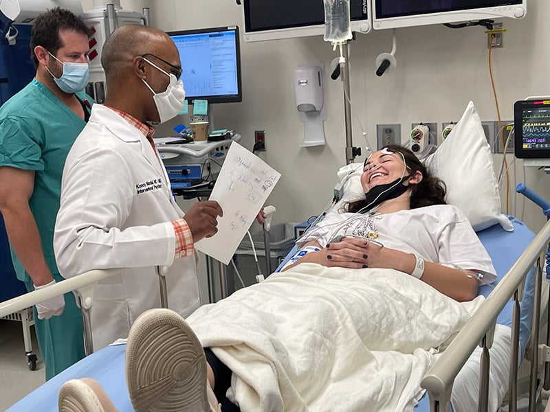 Dr. Konoy Mandal, a psychiatrist and medication director of UCHealth Refractory Depression Clinic at Longs Peak Hospital, speaks with Hannah Wyatt Sultan, 28, who is receiving her last ECT therapy. Photo by Kelly Tracer, UCHealth.