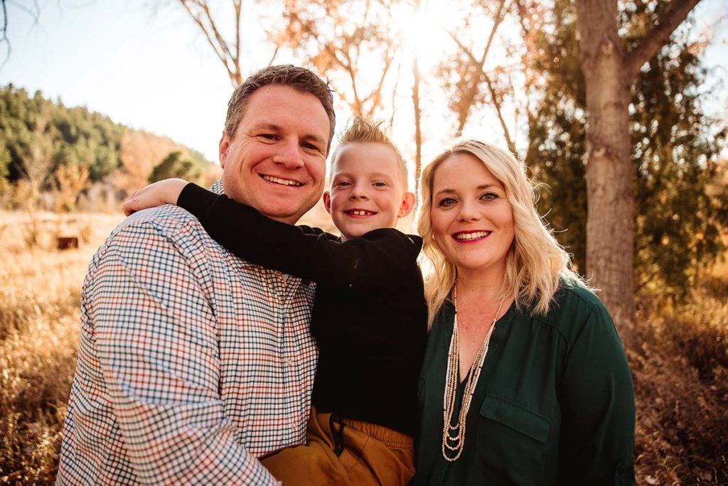 Melanie McLaughlin, who was diagnosed with Cogan's Syndrome, is photographed with her husband and son.