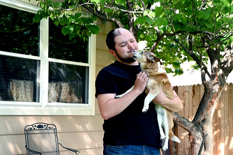 Family dog Toto with Jack O'Donnell, who is living with oligodendroglioma.