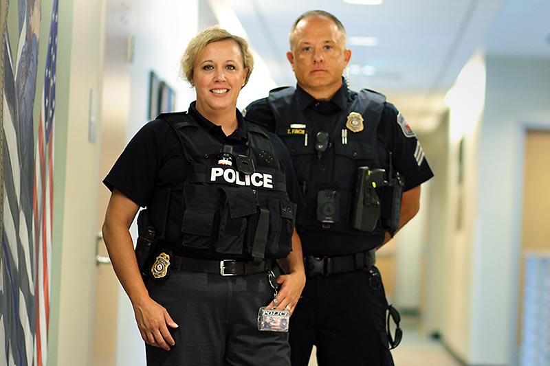 Police detective Elizabeth Finch, left, and her husband, Srgt. Todd Finch, met at work and continue to work together at the Greeley Police Department. Photo by Joel Blocker, for UCHealth.