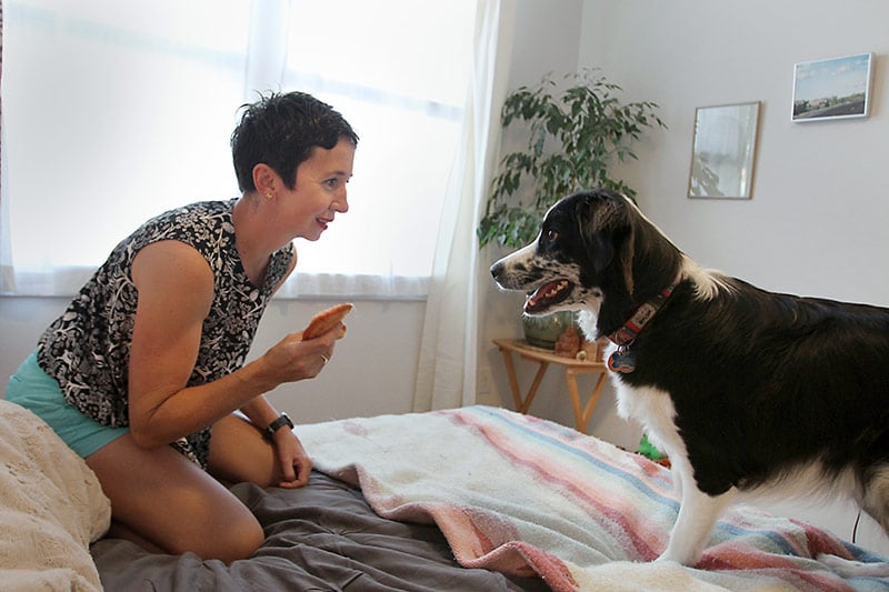 Taryn Sargent plays with her dog, Bobby.