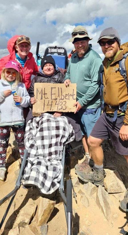 Christine Gilmore, who is living with ALS, summits Mount Elbert in September 2021.