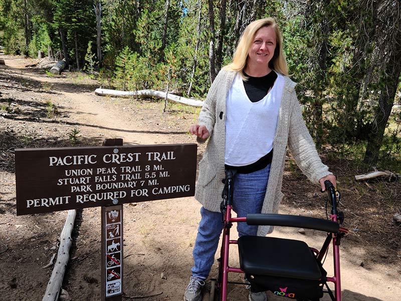 Christine Gilmore hikes the Pacific Crest Trail. Although life with ALS is more challenging, Gilmore hasn't let it stop her from seeking new adventures.