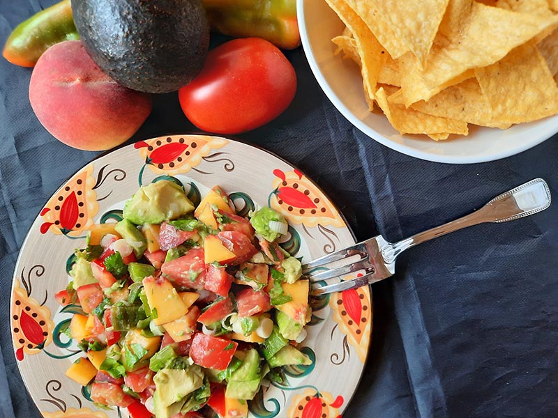 Spicy peach-accented guacamole, a reminder that the full name of “guacamole” is “guacamole salad.” Photo courtesy of Bill St. John.