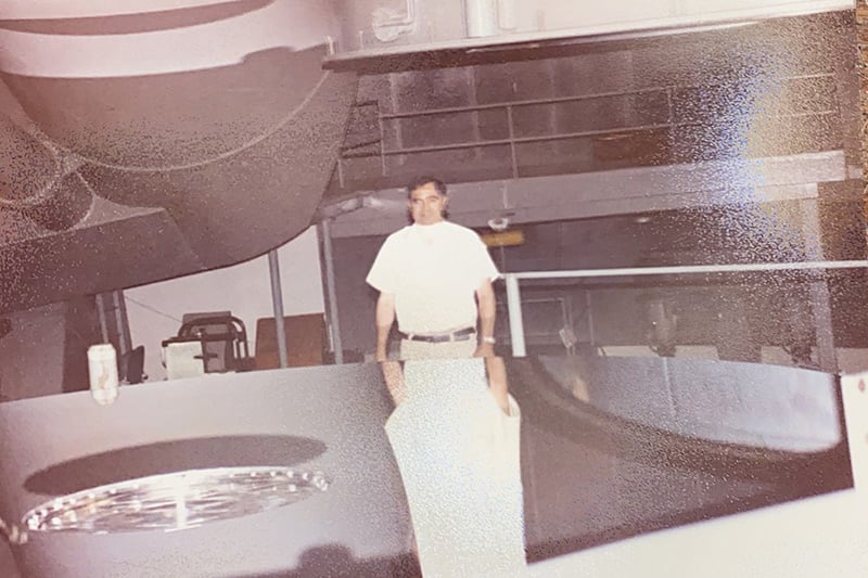 Dr. Abbey Lara's father with the giant mirror on the Caltech telescope that he maintained. Photo courtesy of Dr. Abbey Lara.
