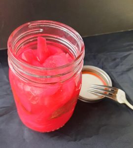 A jar of pink pickled turnips. Photo by Bill St. John