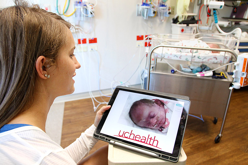 Erin Decker demonstrates how the NICU cameras allowed her to see her son, Mason, when she was home sick just days after his birth.