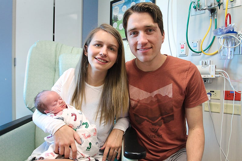 Erin and David Decker with their son, Mason, who was born six weeks early.