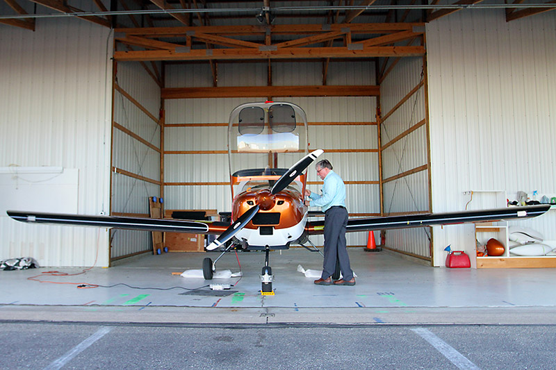 William Snodgrass, who participated in research about tibia fractures, preps a plane at Northern Colorado Regional Airport.