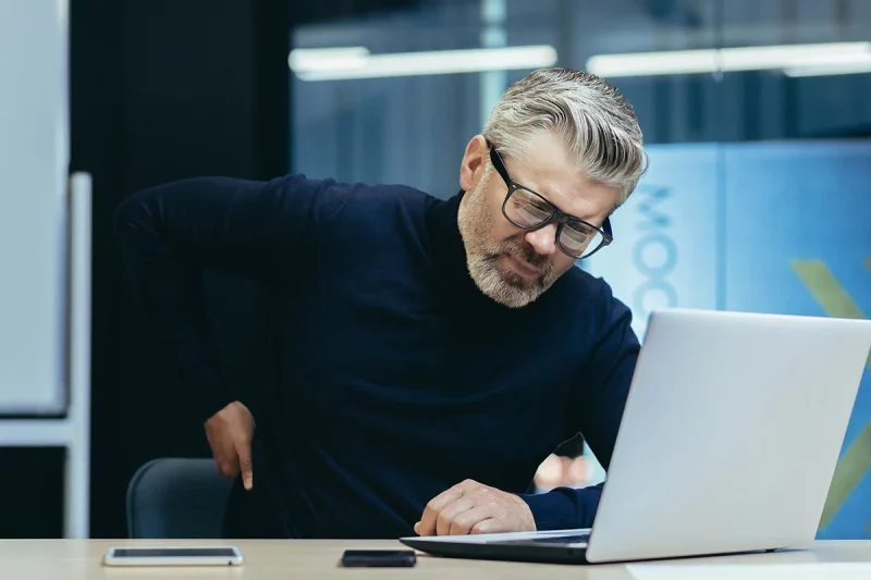 Millions suffer from chronic back pain, and in some cases, it's caused by an autoimmune and inflammatory disease. A new clinical trial aims to find new ways to detect and treat spondyloarthritis early by studying those at risk. Photo: Getty Images. 